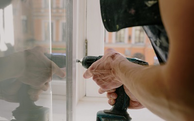 A window pane being drilled in to place